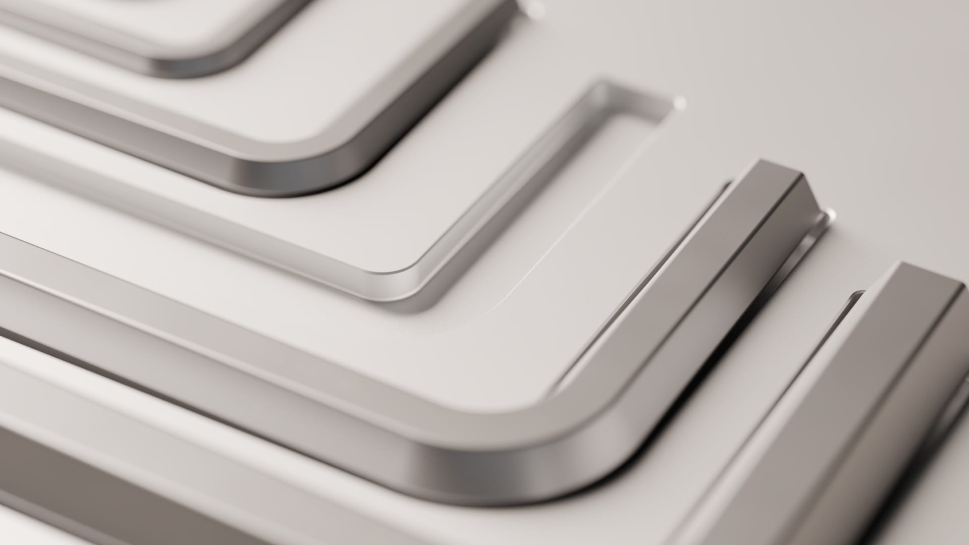 Close view of the bend geometry: several hex wrenches seated in their machined recesses, each with a generous radius where the long and short arms meet.