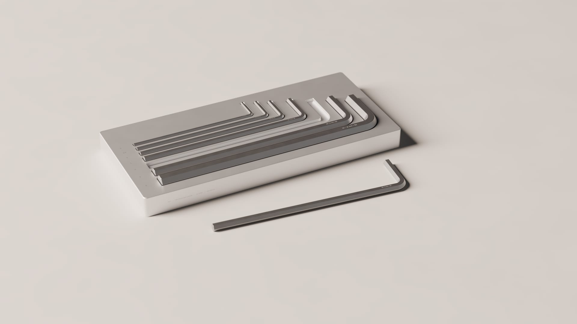 W01: seven hex wrenches seated in a machined aluminum storage block, with one wrench lying beside it.