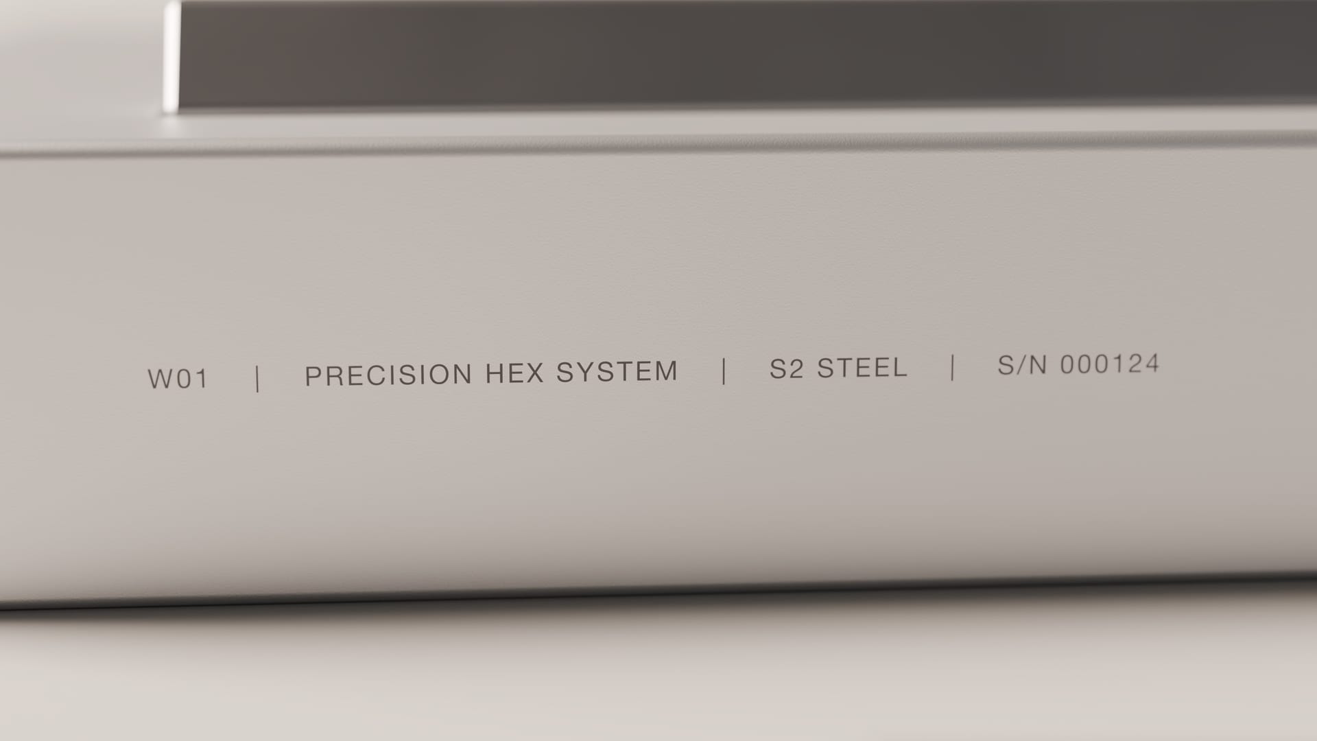 The edge of the storage block, engraved: W01, Precision Hex System, S2 Steel, S/N 000124.